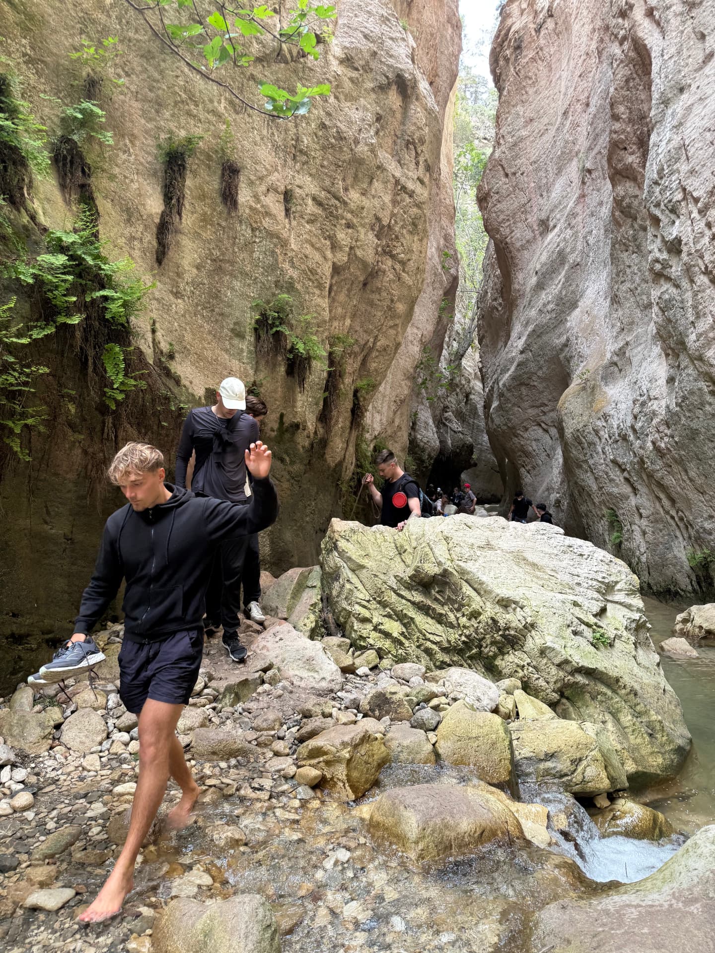 Group exploring a rocky gorge in Cyprus